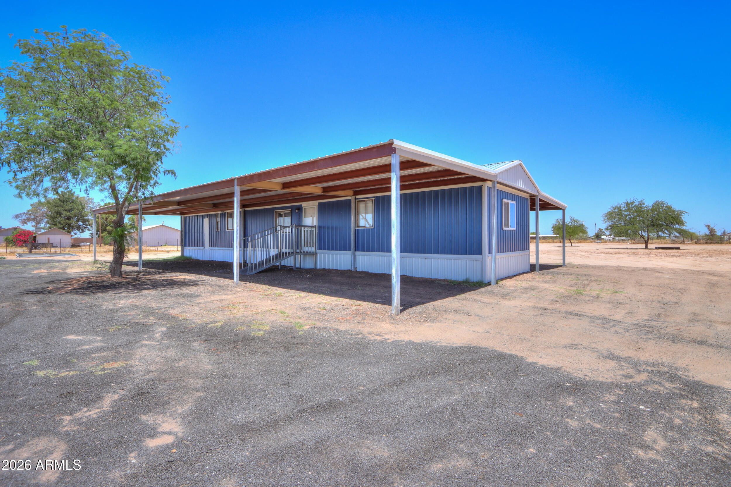 33776 West Siesta Road Stanfield, AZ 85172 - Photo 2 of 54 a view of a house with a yard