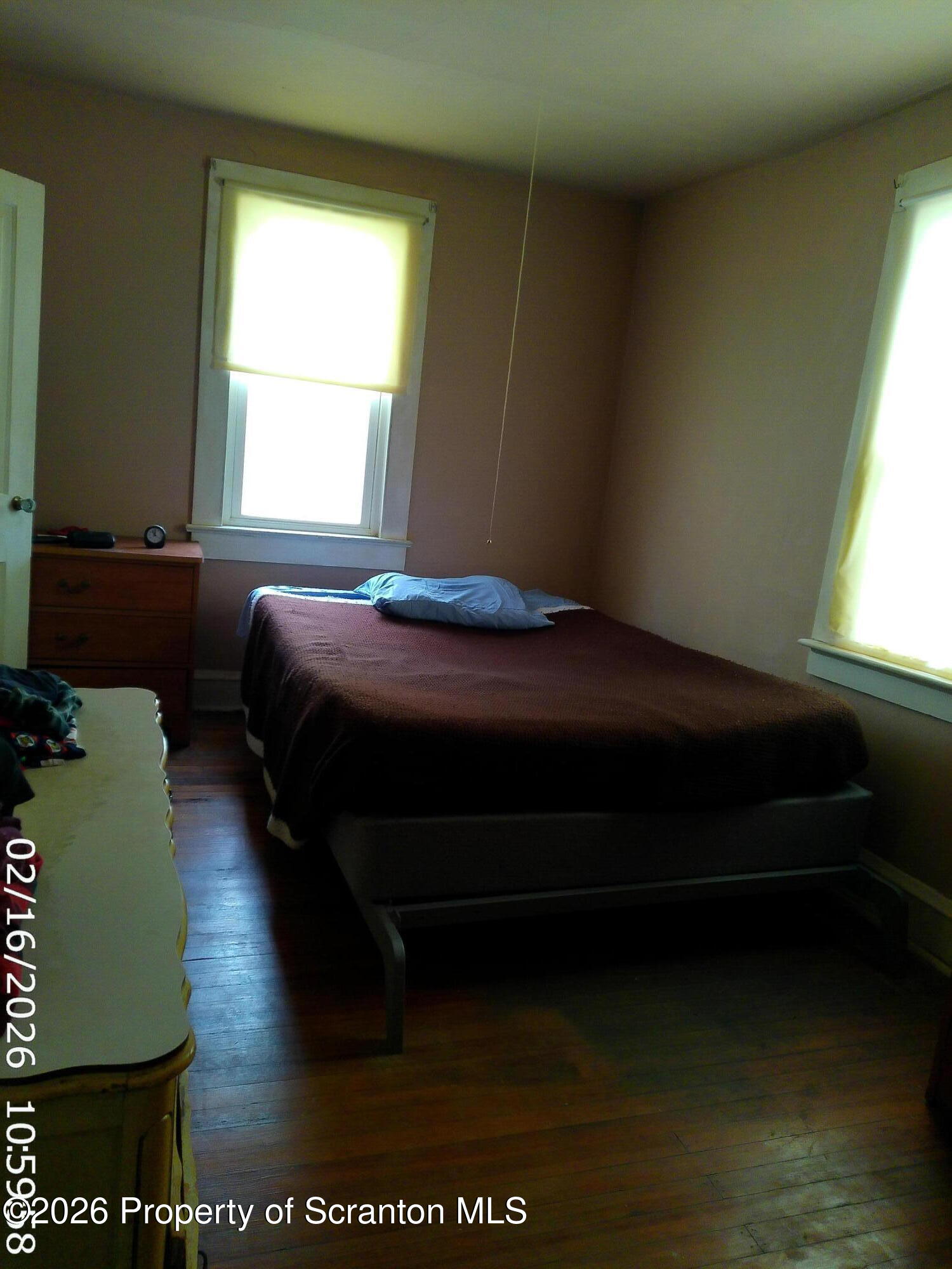 319 South 9th Avenue Scranton, PA 18504 - Photo 15 of 49 a bedroom with a bed dresser and a window