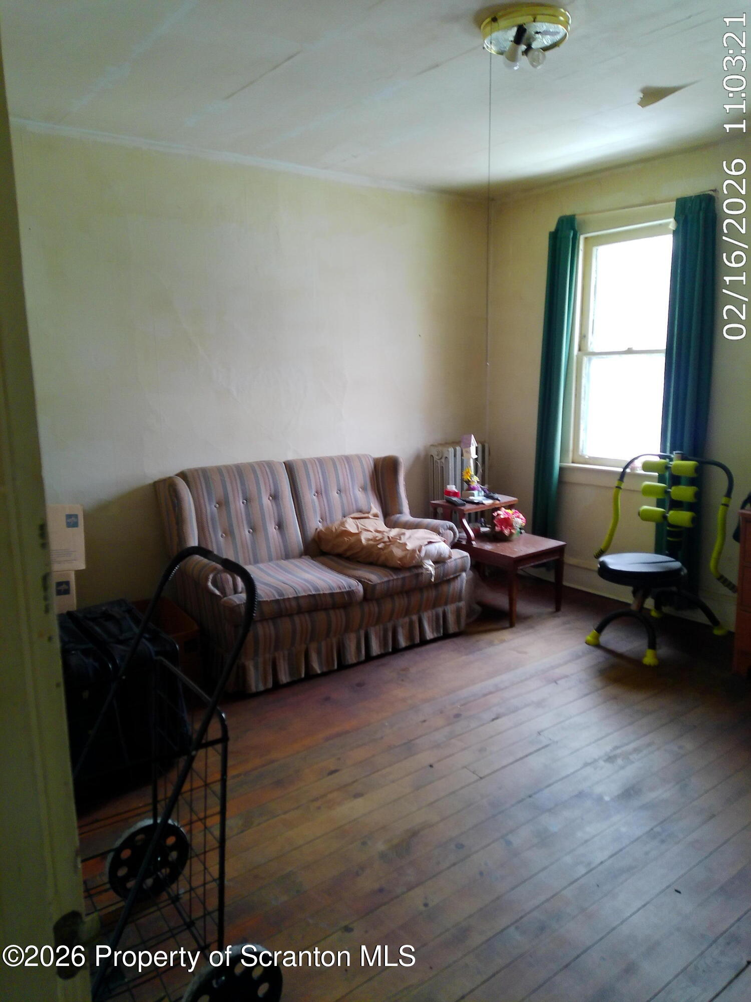 319 South 9th Avenue Scranton, PA 18504 - Photo 25 of 49 a living room with furniture and a window