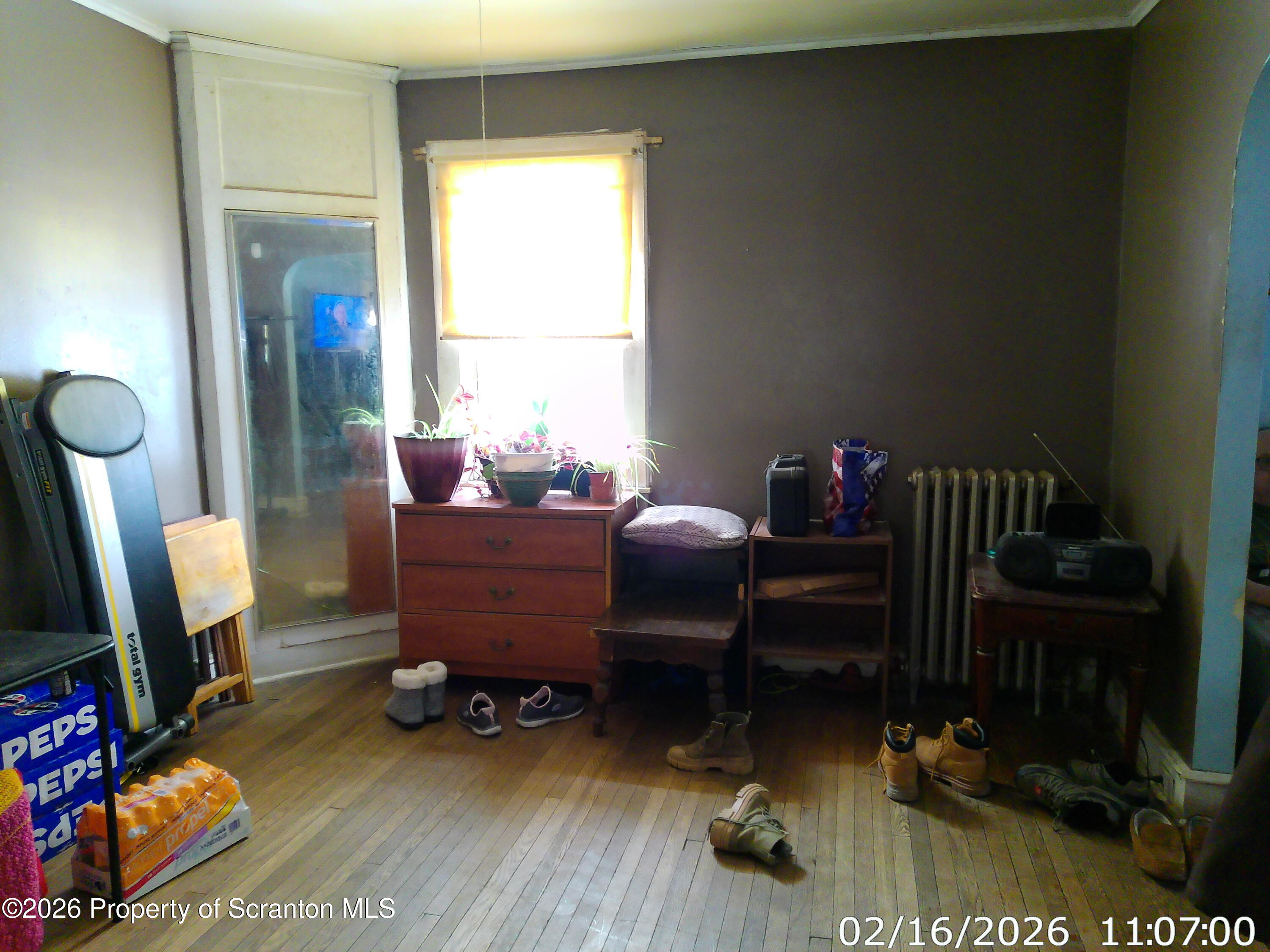 319 South 9th Avenue Scranton, PA 18504 - Photo 9 of 49 a living room with furniture and a flat screen tv