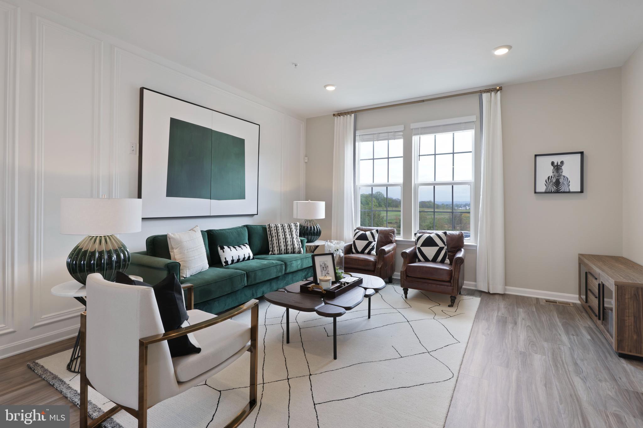 1271 Apollo Drive Frederick, MD 21702 - Photo 2 of 35 a living room with furniture a large window and a flat screen tv