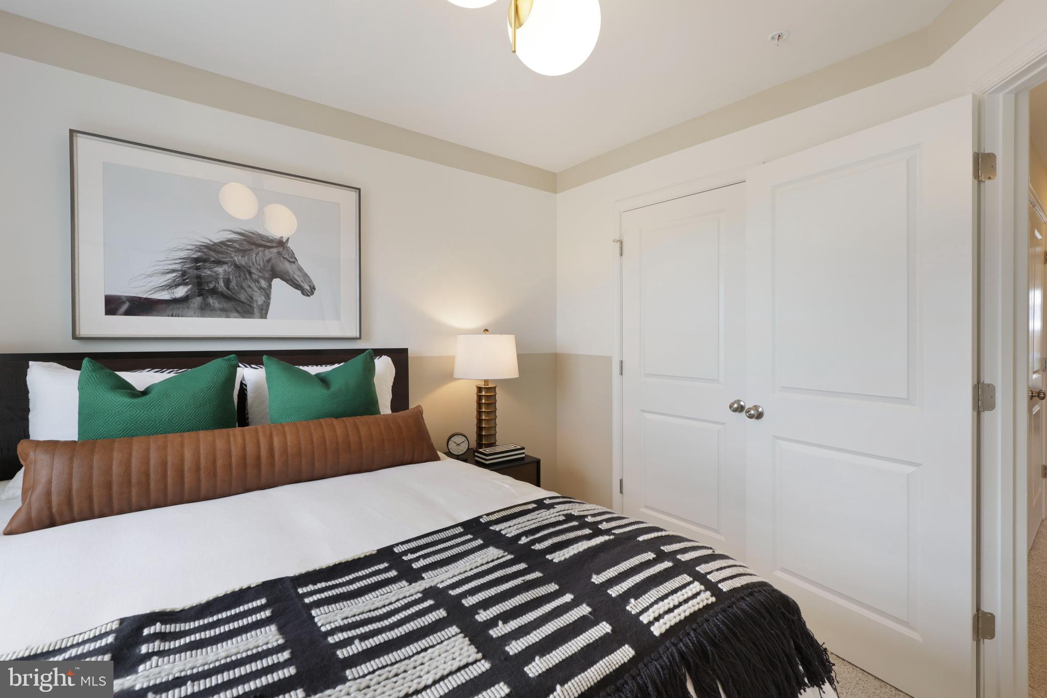 1271 Apollo Drive Frederick, MD 21702 - Photo 24 of 35 a bedroom with a bed and a painting on the wall