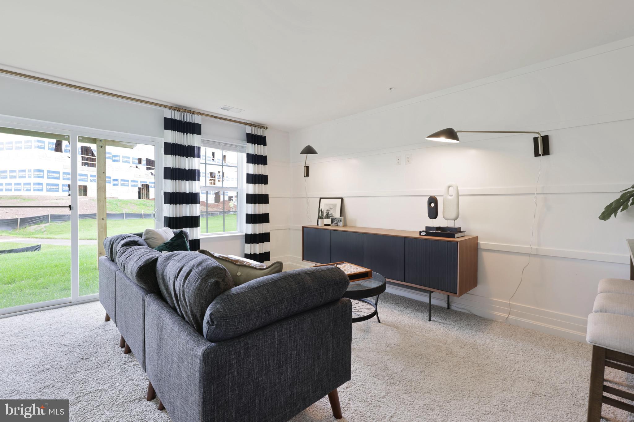 1271 Apollo Drive Frederick, MD 21702 - Photo 29 of 35 a living room with furniture and a floor to ceiling window