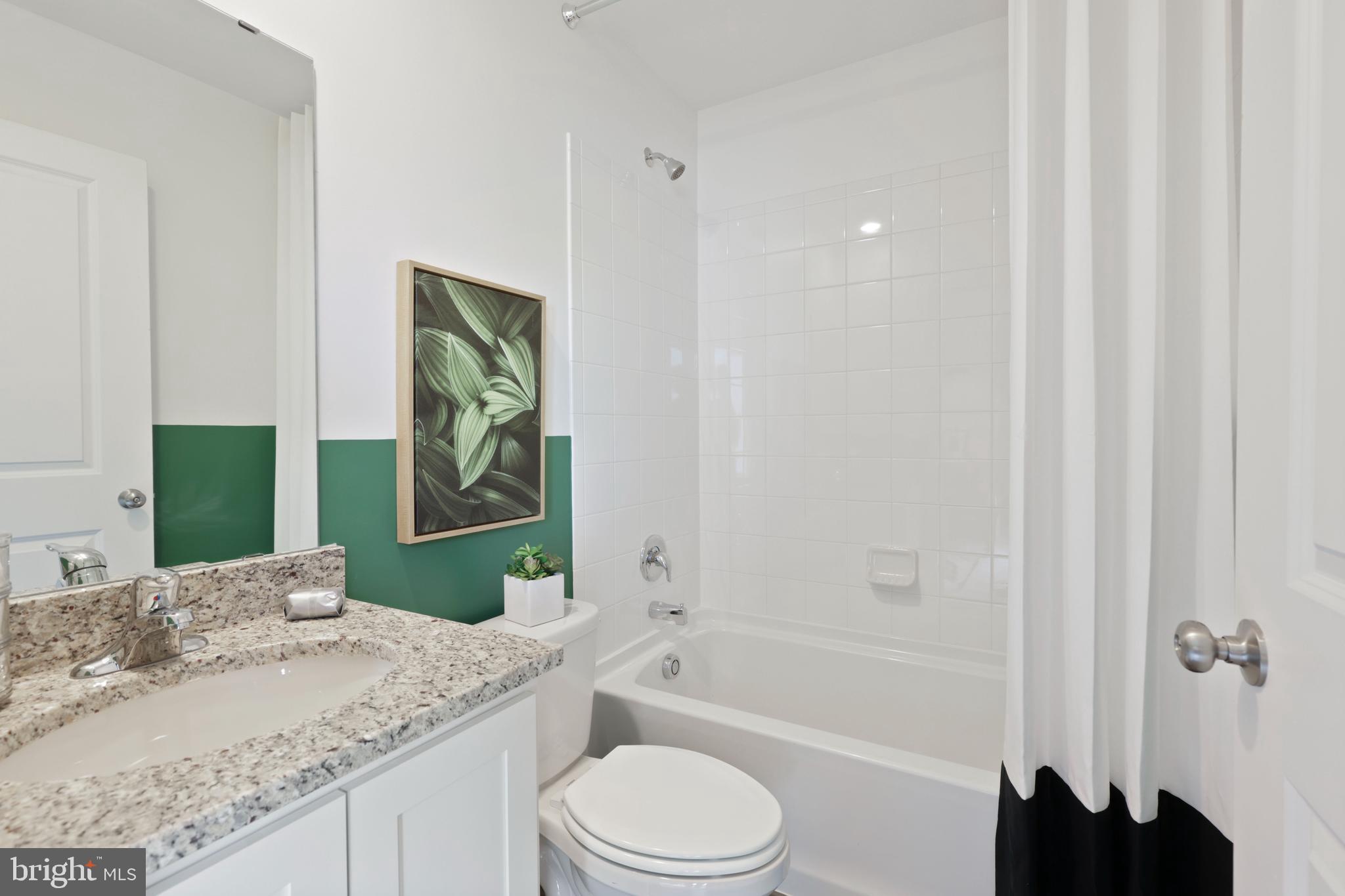 1271 Apollo Drive Frederick, MD 21702 - Photo 32 of 35 a bathroom with a granite countertop sink toilet and shower