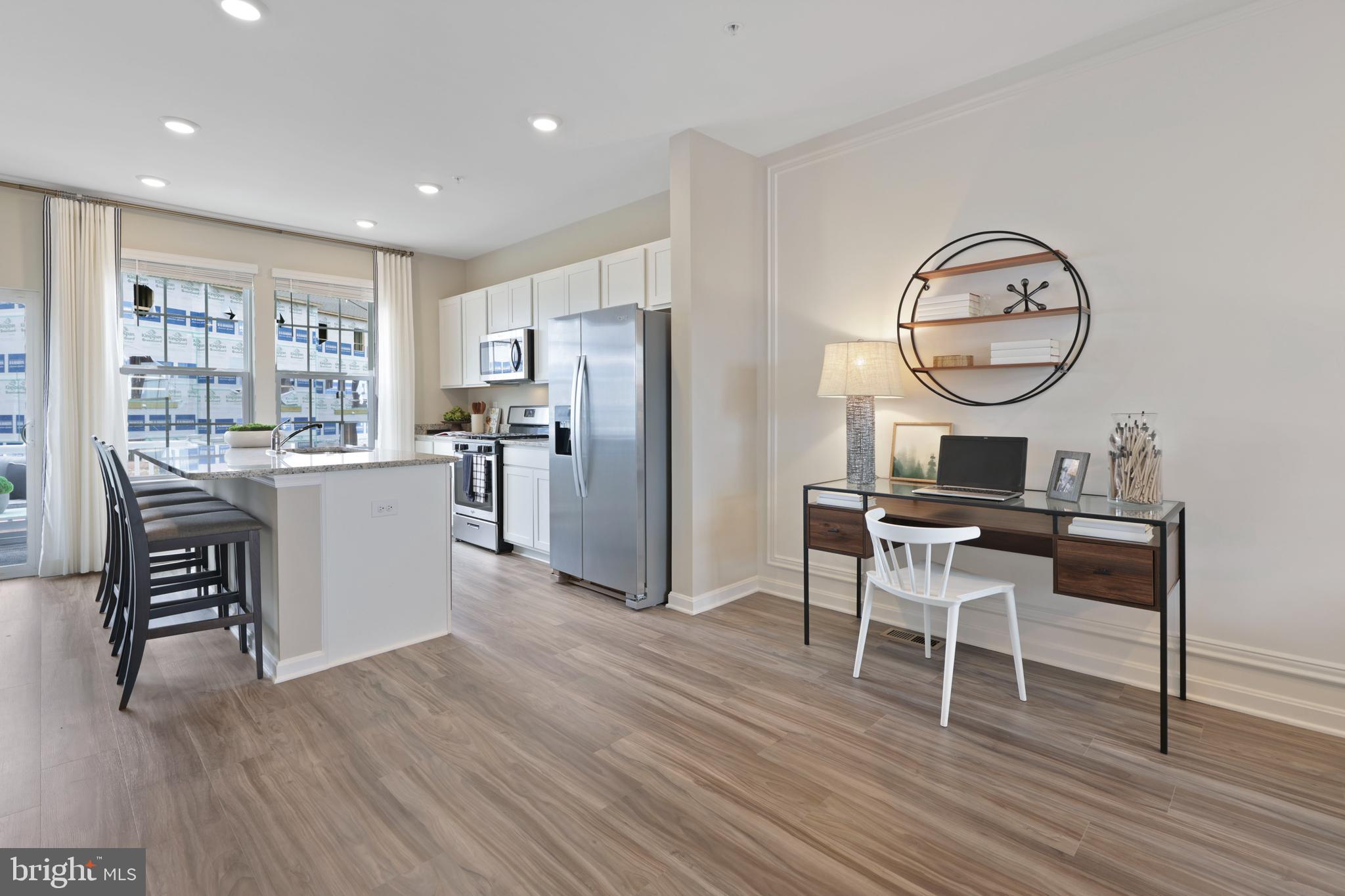 1271 Apollo Drive Frederick, MD 21702 - Photo 4 of 35 a workspace with wooden floor and a view of kitchen