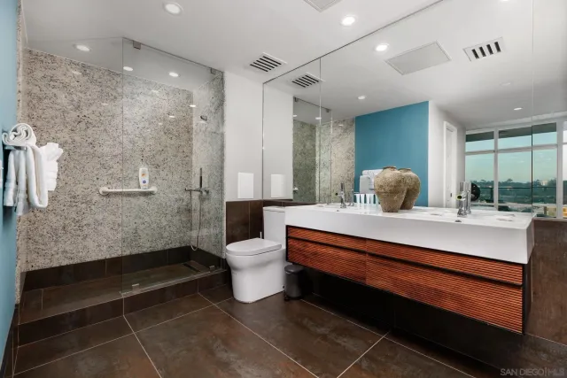 a room with a couch and a potted plant