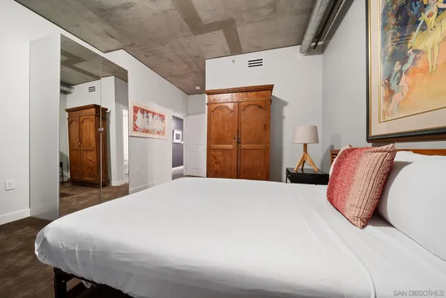 a bedroom with a bed and a dresser