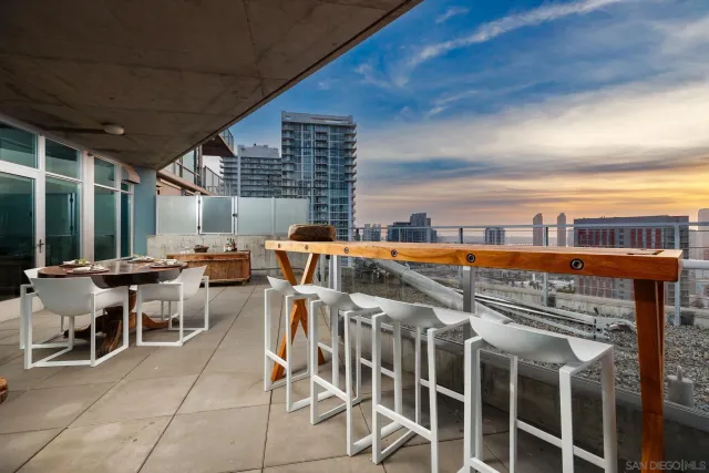 a view of a chairs and table in patio