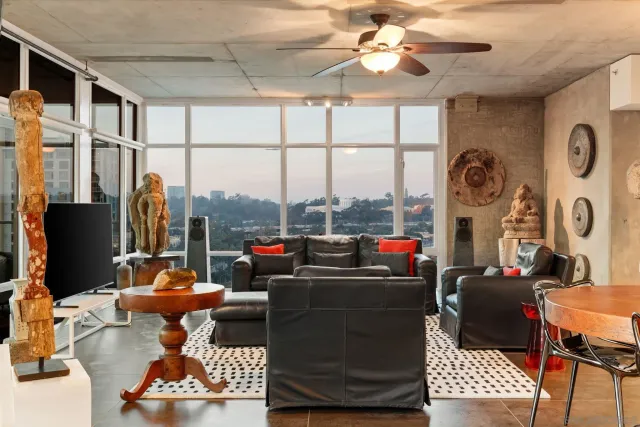a living room with furniture and a large window