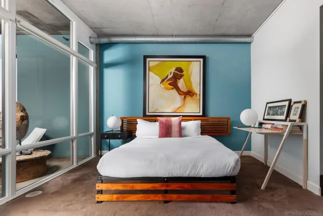 a bedroom with a bed and window