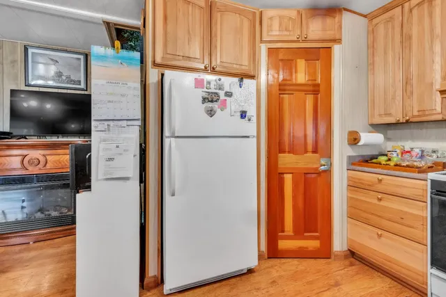 a bed room with a bed and a large mirror