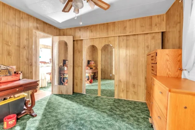 a view of a city with lush green forest