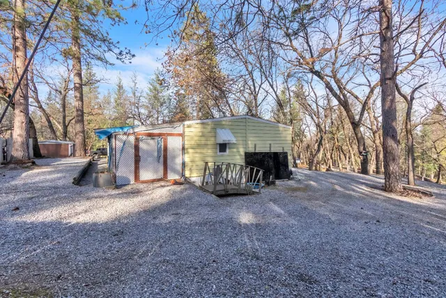a view of a house with a yard and garage