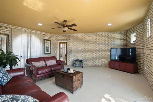 a bedroom with bed and window