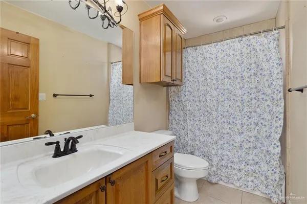 a bedroom with bed and a window