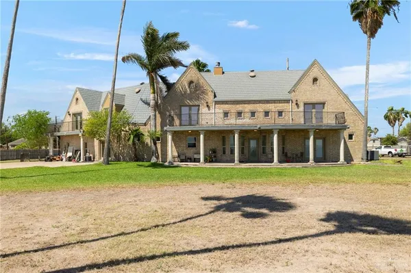 an aerial view of a house with outdoor space