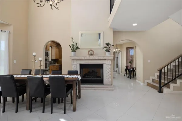 a kitchen with kitchen island a counter top space a sink stainless steel appliances and cabinets