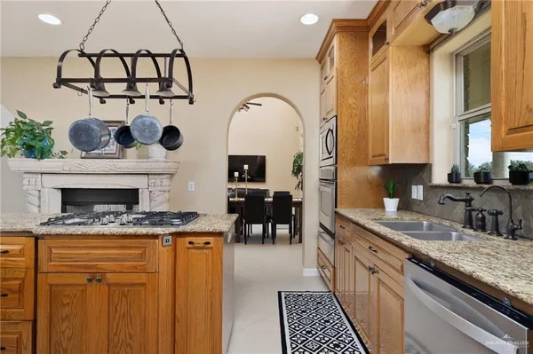 a view of a dining room with furniture and a chandelier