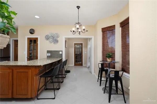 a living room with furniture windows and a flat screen tv
