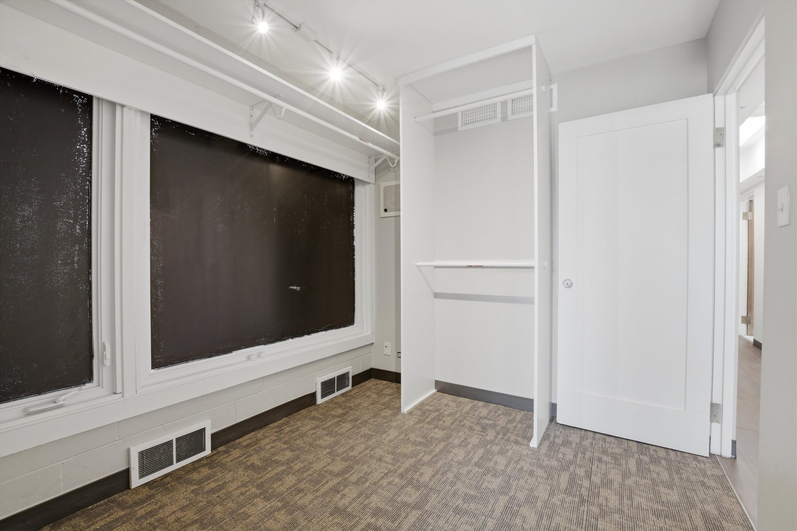10550 West Cermak Road Westchester, IL 60154 - Photo 13 of 43 a view of an empty room with wooden floor and cabinet