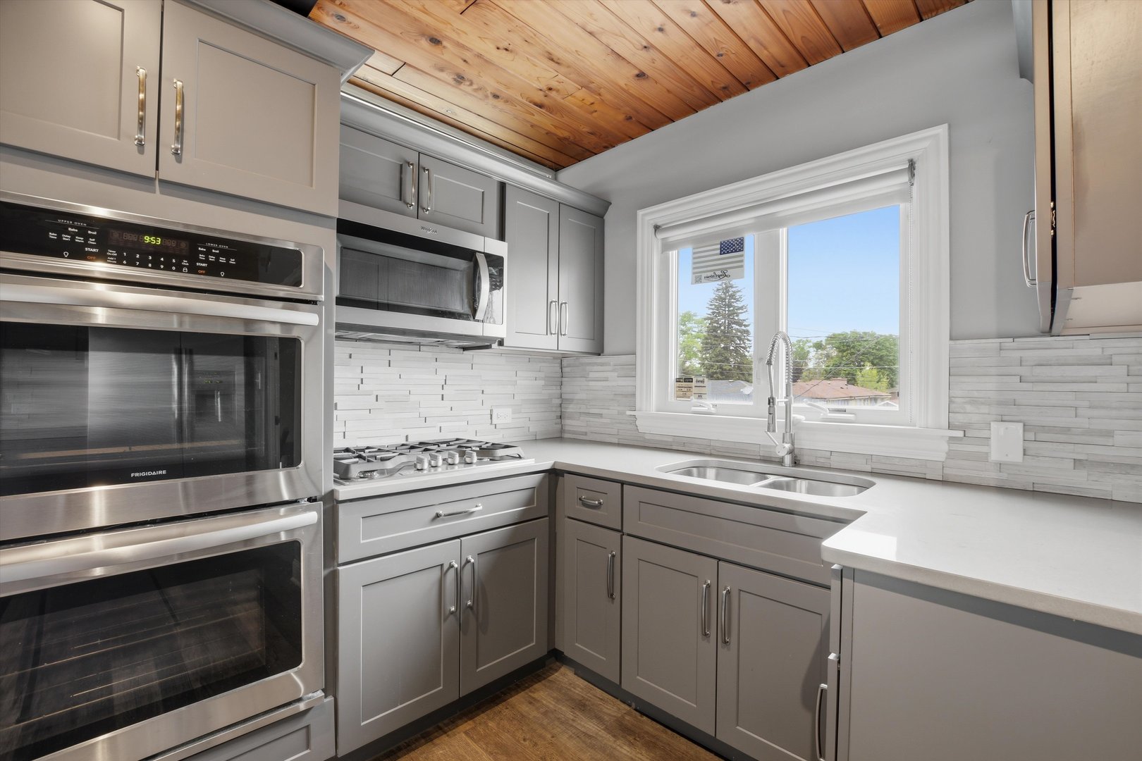 10550 West Cermak Road Westchester, IL 60154 - Photo 15 of 43 a kitchen with stainless steel appliances granite countertop a sink stove and microwave