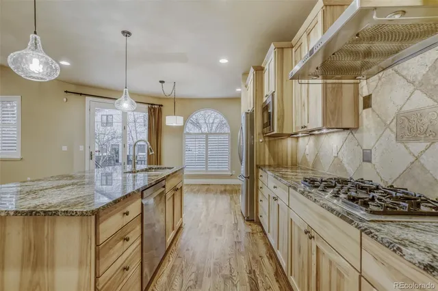 a kitchen with stove and cabinets