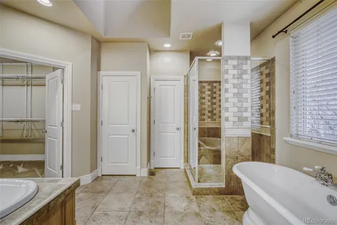 a bathroom with a bathtub and a sink