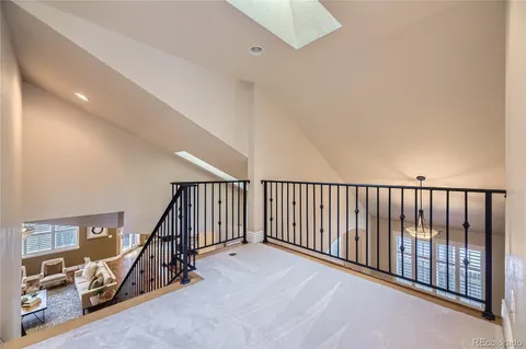 a view of a hallway with staircase