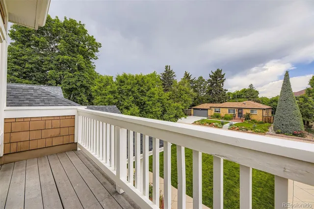 a view of a balcony with wooden floor