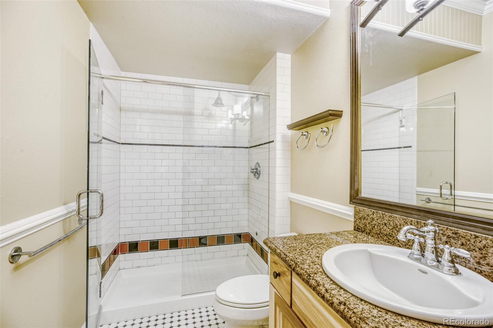 940 Kearney Street Denver, CO 80220 - Photo 39 of 49 a bathroom with a sink and a mirror