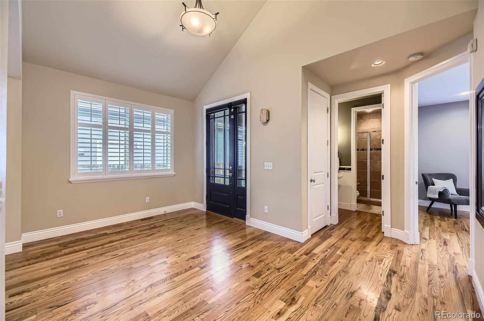 940 Kearney Street Denver, CO 80220 - Photo 4 of 49 a view of livingroom with hardwood floor and hallway
