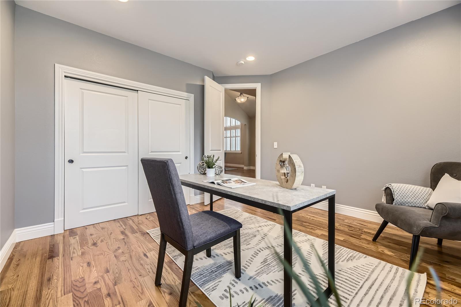 940 Kearney Street Denver, CO 80220 - Photo 6 of 49 a view of a workspace with furniture and wooden floor