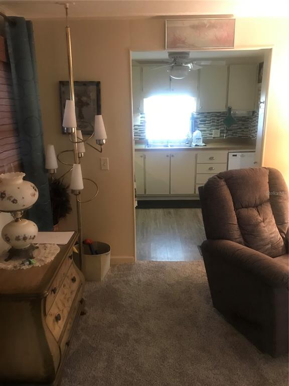 11076 100th Street, Unit 41 Largo, FL 33773 - Photo 11 of 17 a living room with furniture and a window