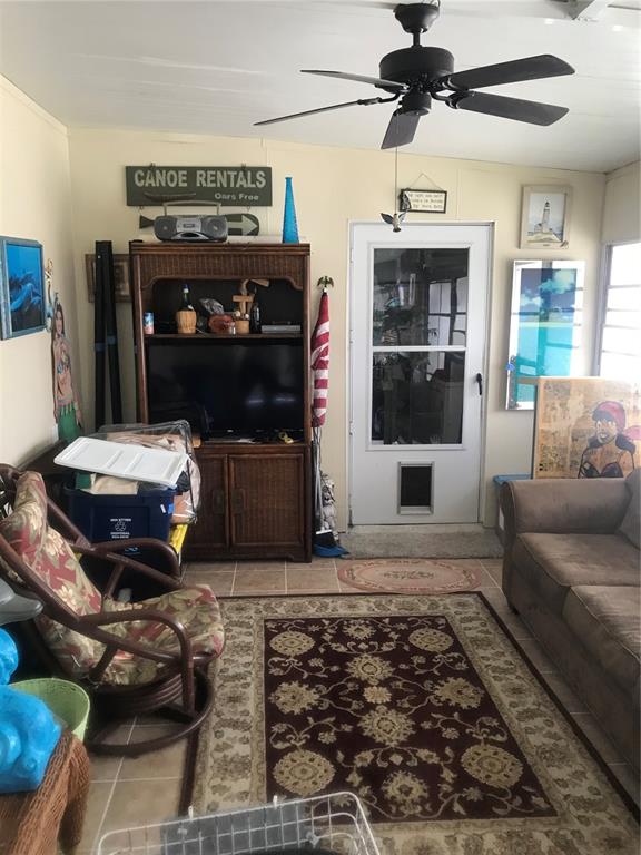 11076 100th Street, Unit 41 Largo, FL 33773 - Photo 17 of 17 a living room with furniture and a fireplace