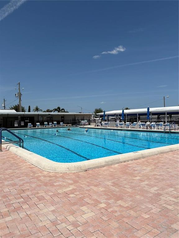 11076 100th Street, Unit 41 Largo, FL 33773 - Photo 2 of 17 a view of swimming pool and outdoor space