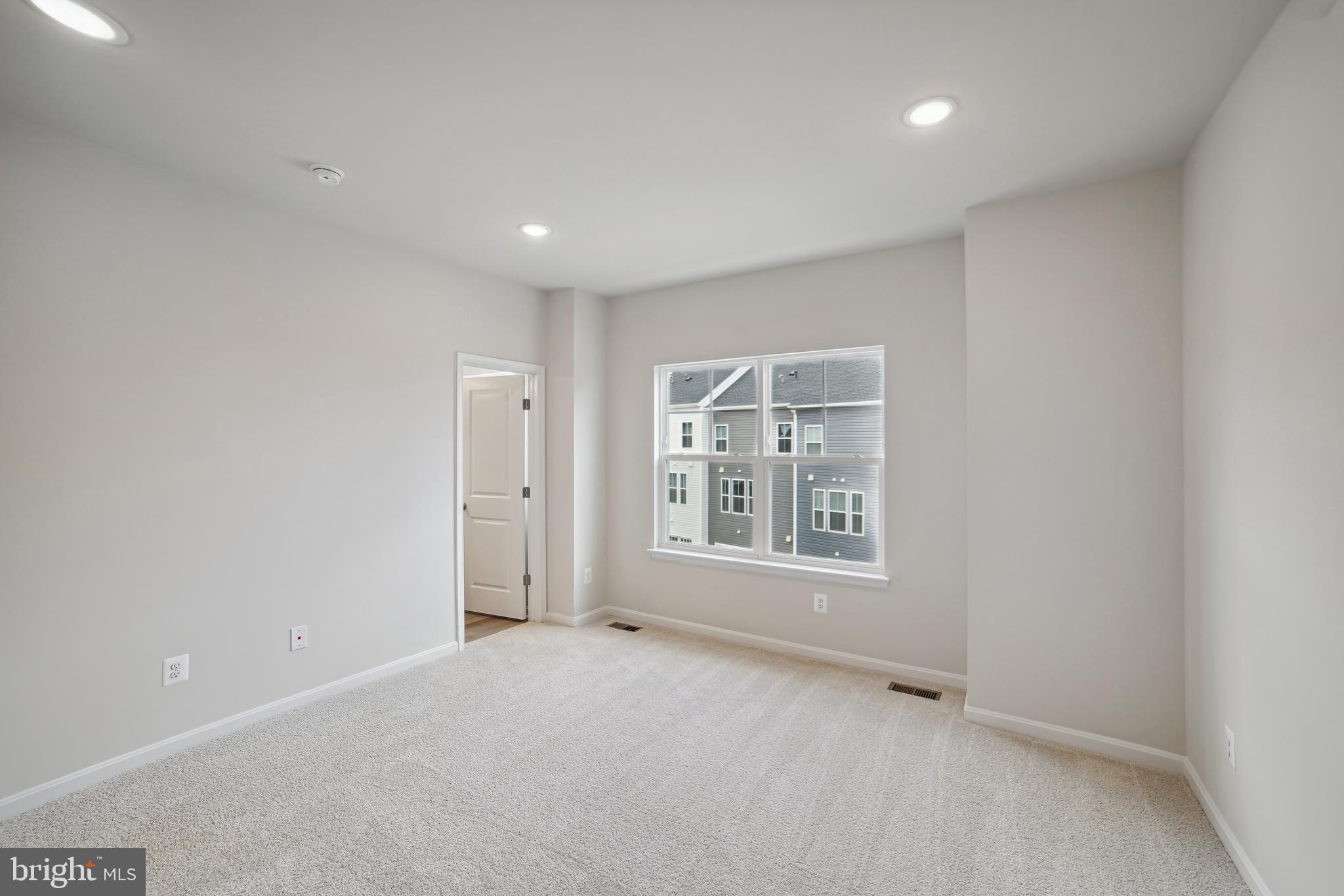 2513 Gatwick Lane Frederick, MD 21701 - Photo 13 of 14 an empty room with a empty space and windows