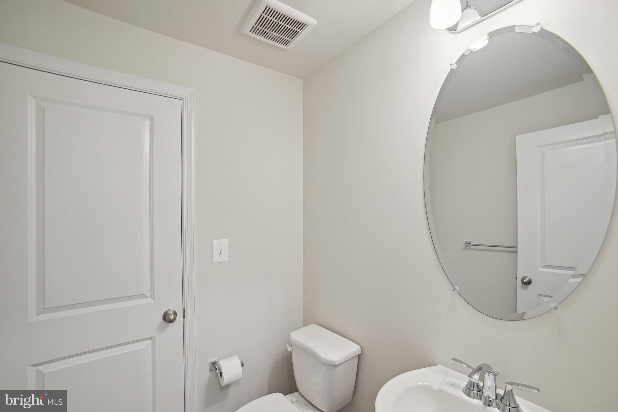 2513 Gatwick Lane Frederick, MD 21701 - Photo 7 of 14 a bathroom with a toilet and a mirror