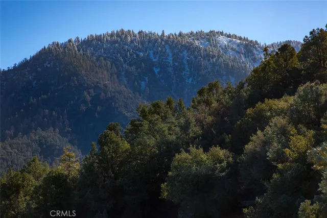 a view of mountains and valleys