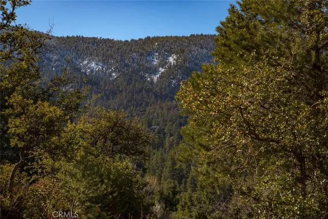 a sign board with a wooden fence