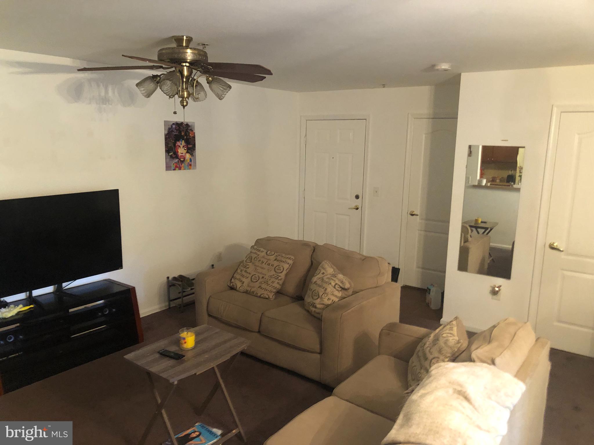 148 Natalie Road Riverside, NJ 08075 - Photo 2 of 13 a living room with furniture and a flat screen tv