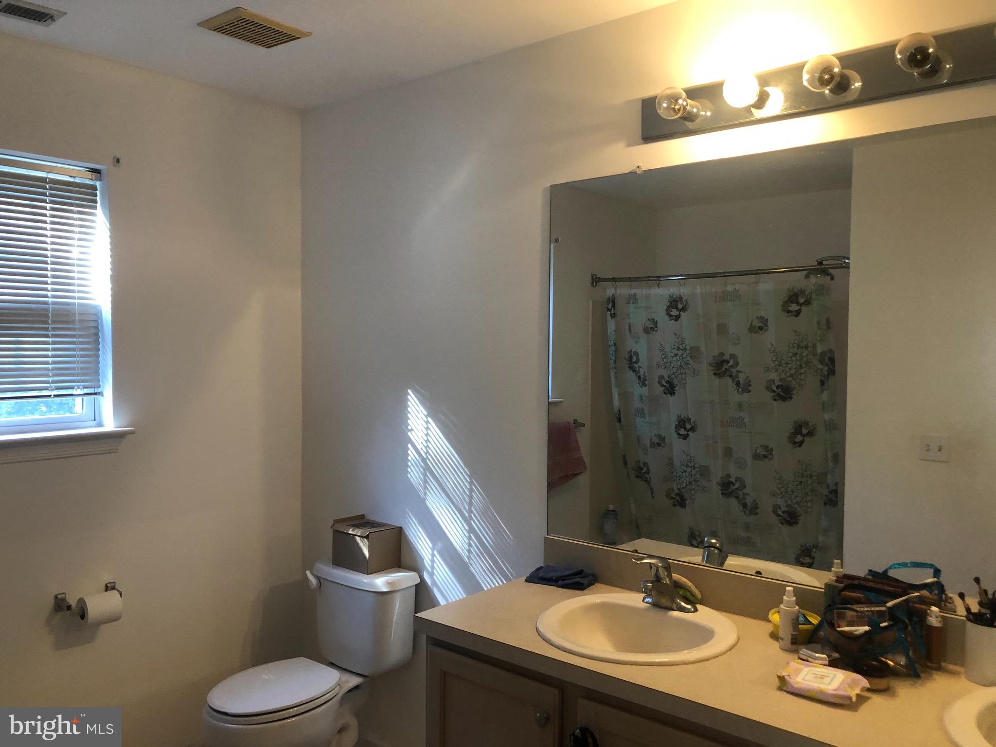 148 Natalie Road Riverside, NJ 08075 - Photo 5 of 13 a bathroom with a sink toilet and a mirror