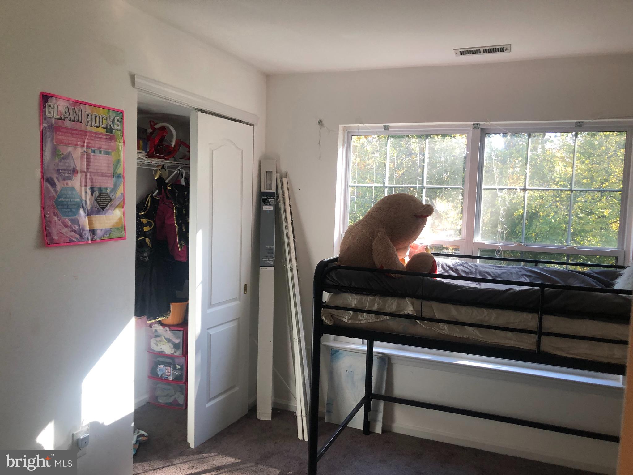 148 Natalie Road Riverside, NJ 08075 - Photo 7 of 13 a living room with furniture and a floor to ceiling window
