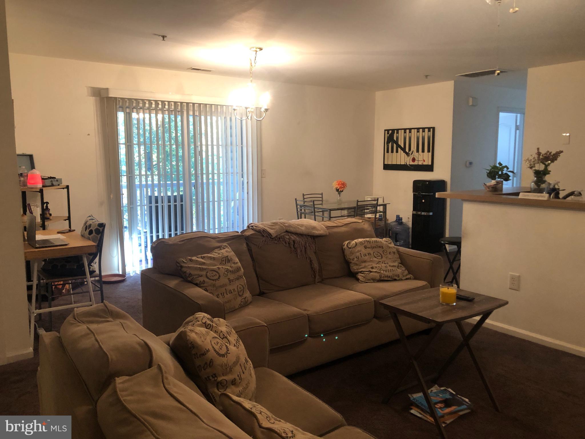 148 Natalie Road Riverside, NJ 08075 - Photo 10 of 13 a living room with furniture and a flat screen tv