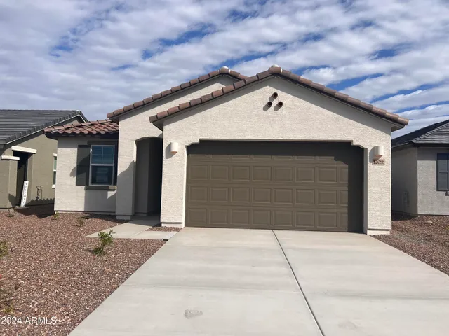a front view of a house with a garage
