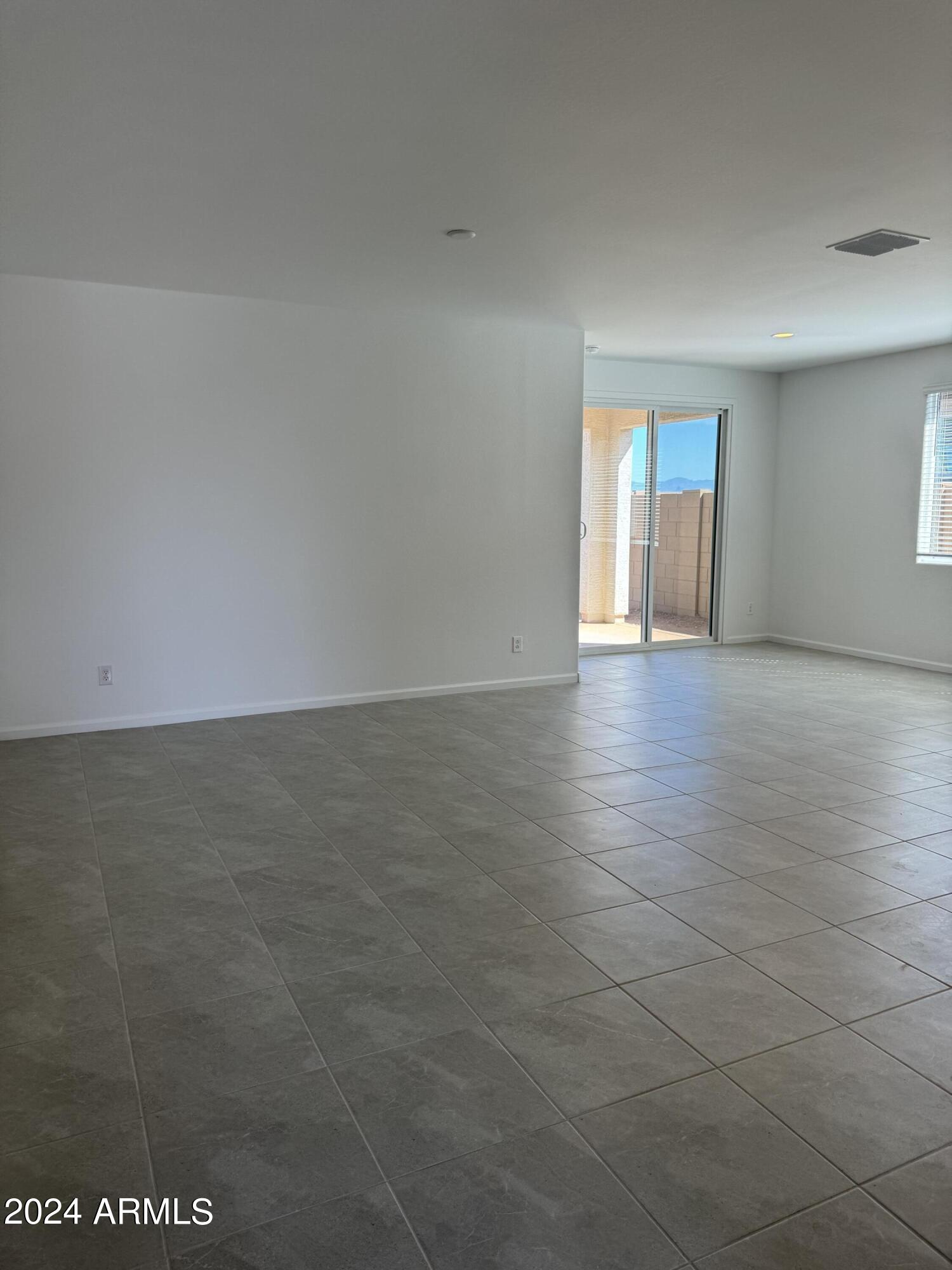 12088 East Verbina Lane Florence, AZ 85132 - Photo 14 of 48 a view of an empty room with a window