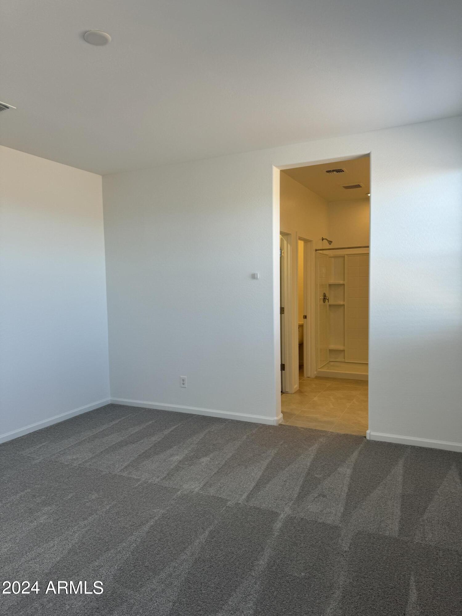 12088 East Verbina Lane Florence, AZ 85132 - Photo 17 of 48 an empty room with a door