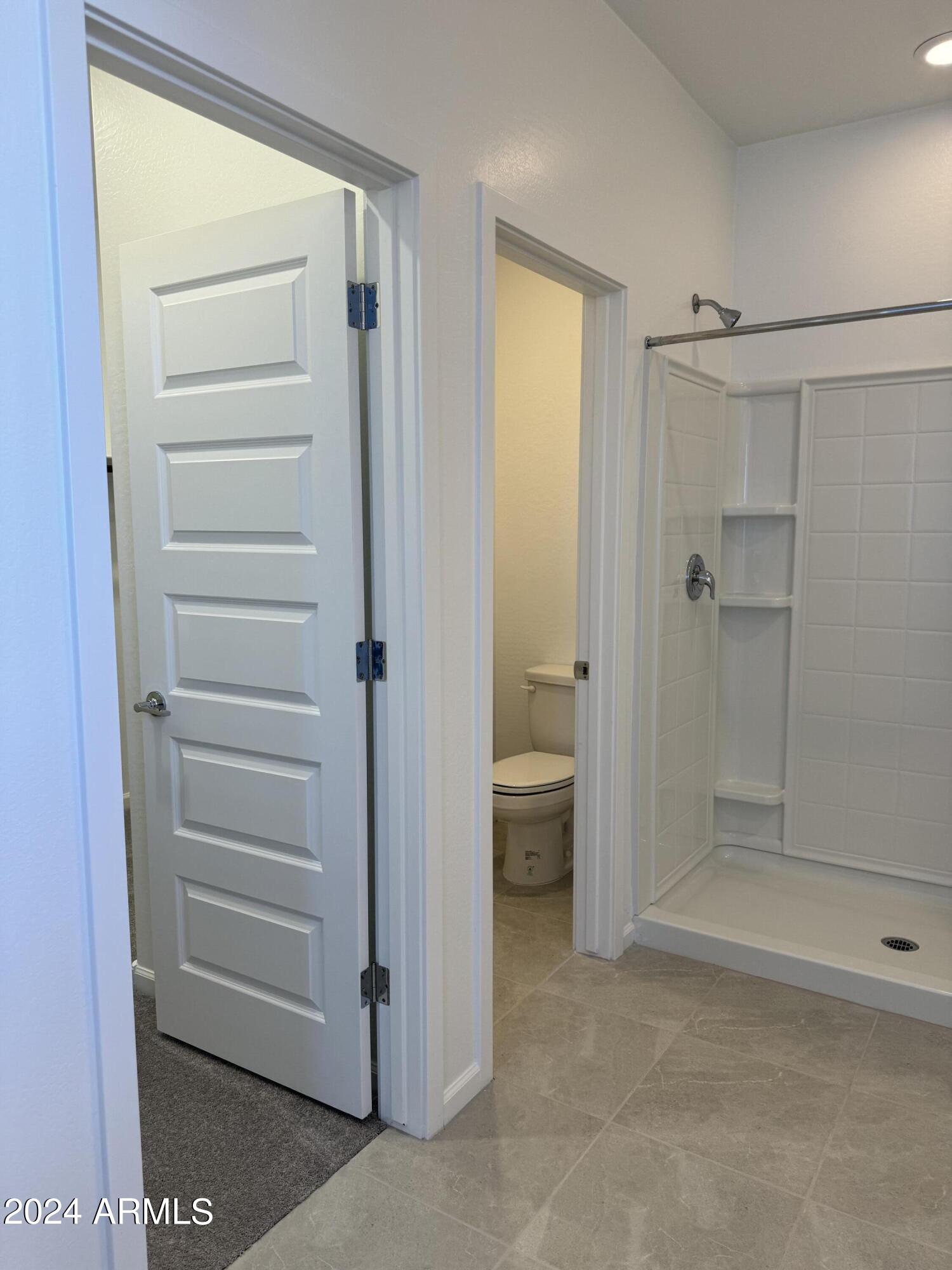 12088 East Verbina Lane Florence, AZ 85132 - Photo 21 of 48 a bathroom with a shower and a sink
