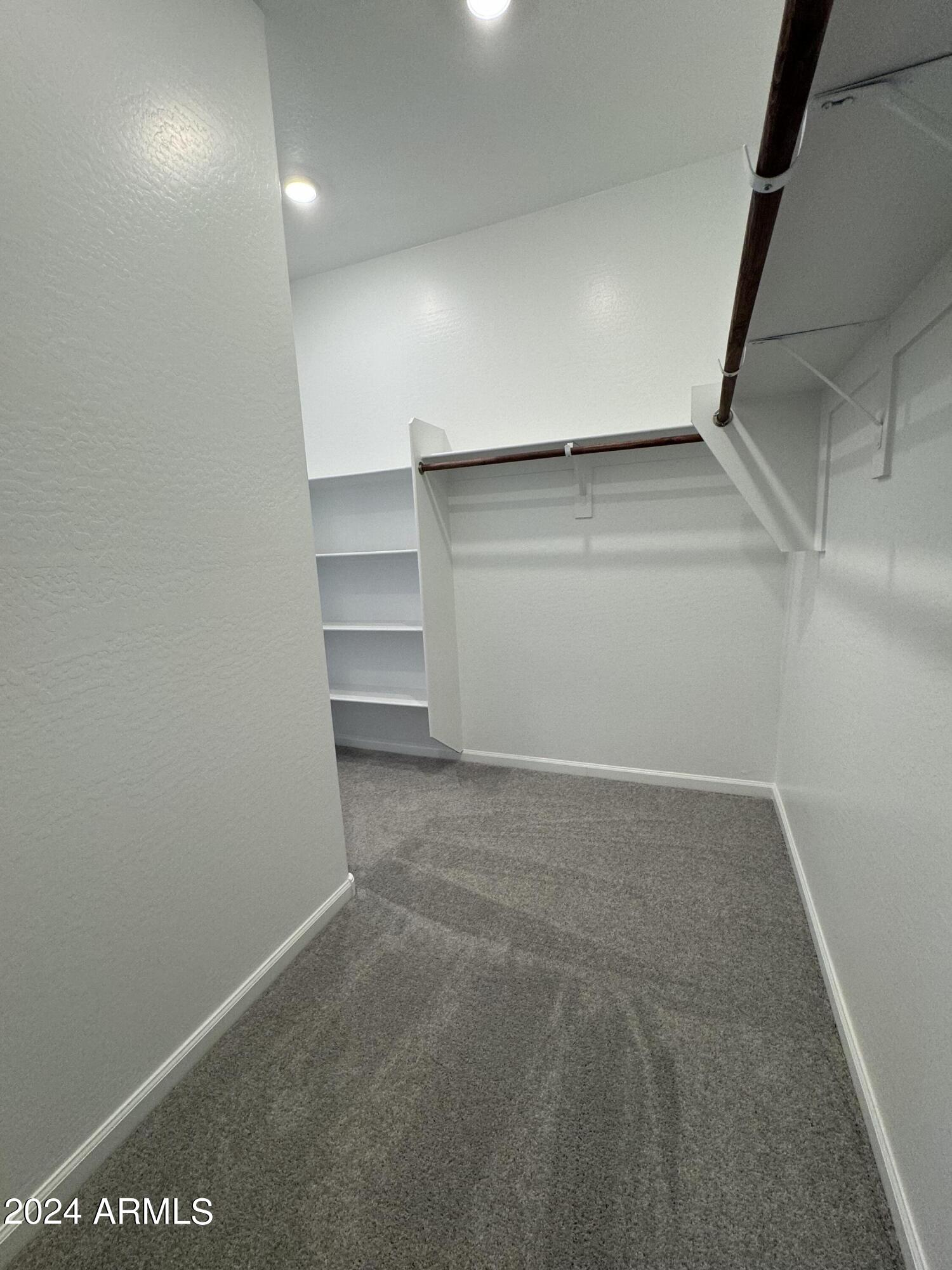 12088 East Verbina Lane Florence, AZ 85132 - Photo 22 of 48 a view of an empty walk in closet