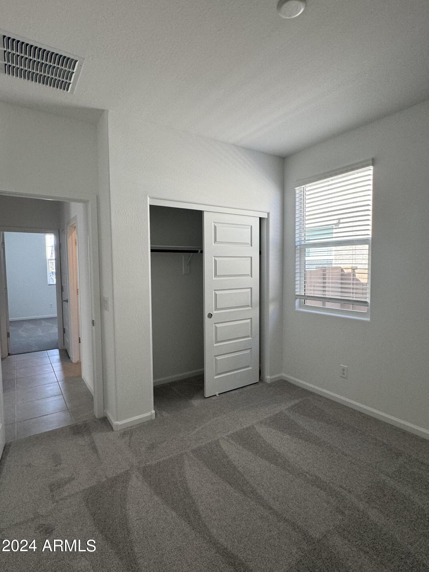 12088 East Verbina Lane Florence, AZ 85132 - Photo 26 of 48 an empty room with windows