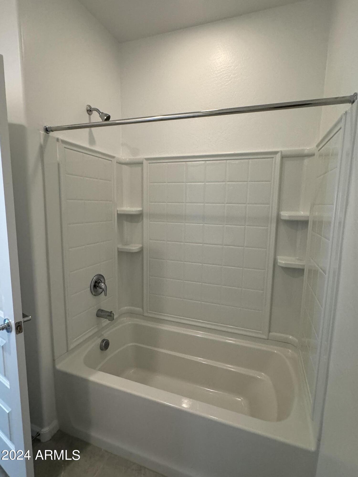 12088 East Verbina Lane Florence, AZ 85132 - Photo 28 of 48 a bathroom with a shower and a bath tub
